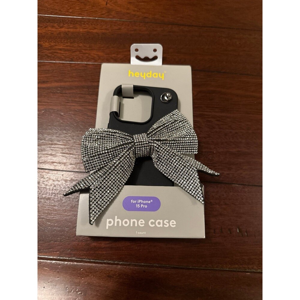 Heyday iPhone 15 Pro case adorned with a large, rhinestone-covered bow embellish